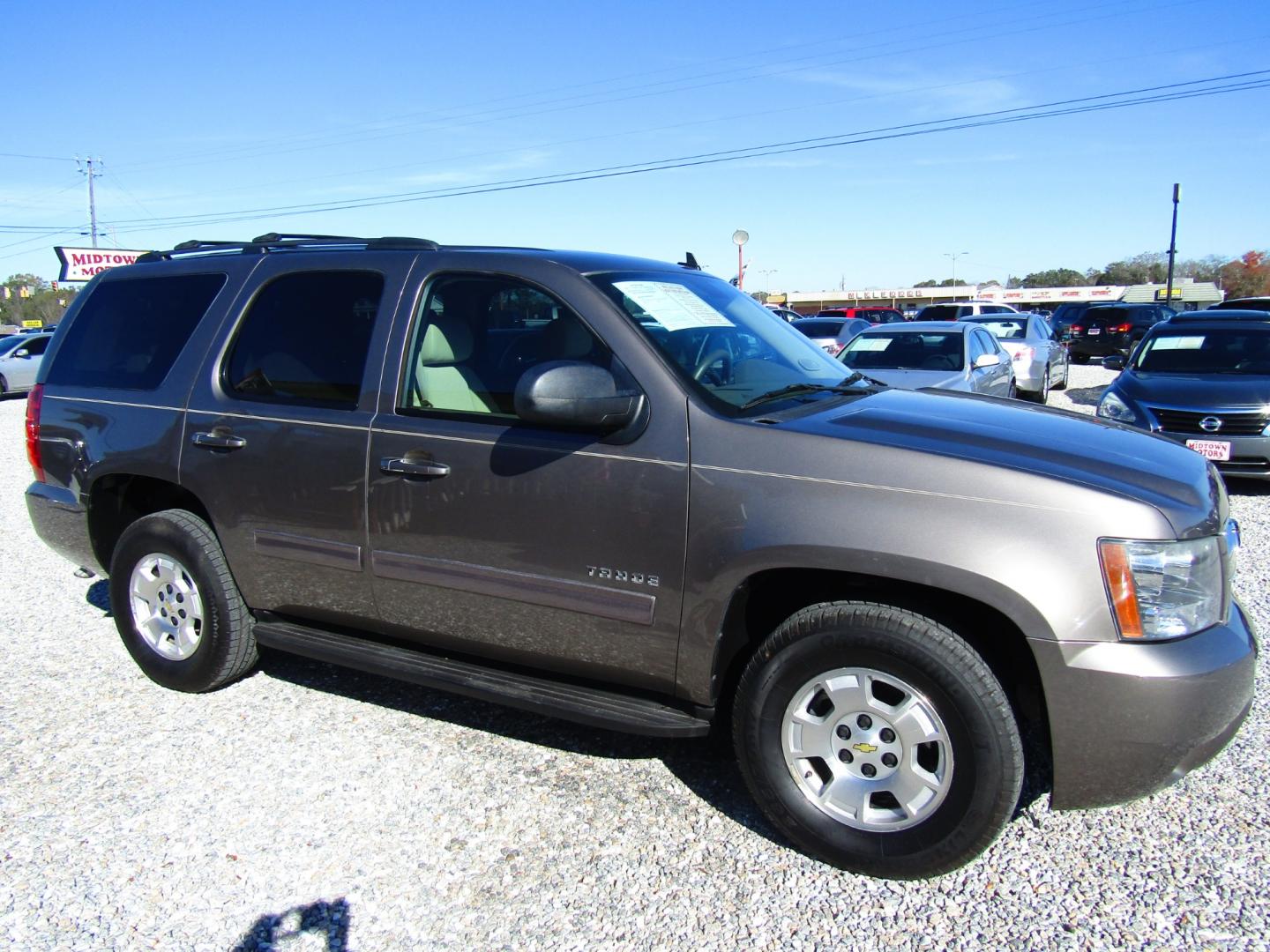 2012 Brown /Tan Chevrolet Tahoe (1GNSCAE07CR) , Automatic transmission, located at 15016 S Hwy 231, Midland City, AL, 36350, (334) 983-3001, 31.306210, -85.495277 - Photo#0